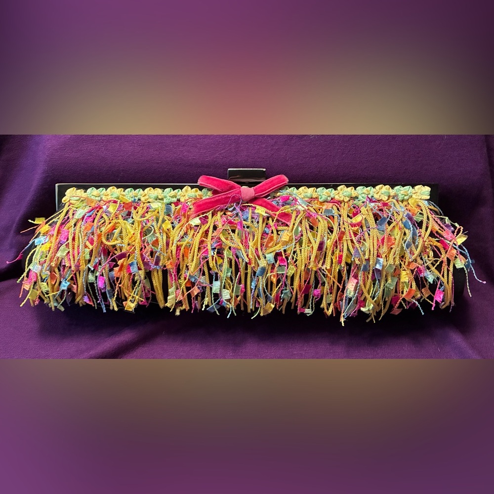 Colorful confetti ribbon clutch with a chain strap.